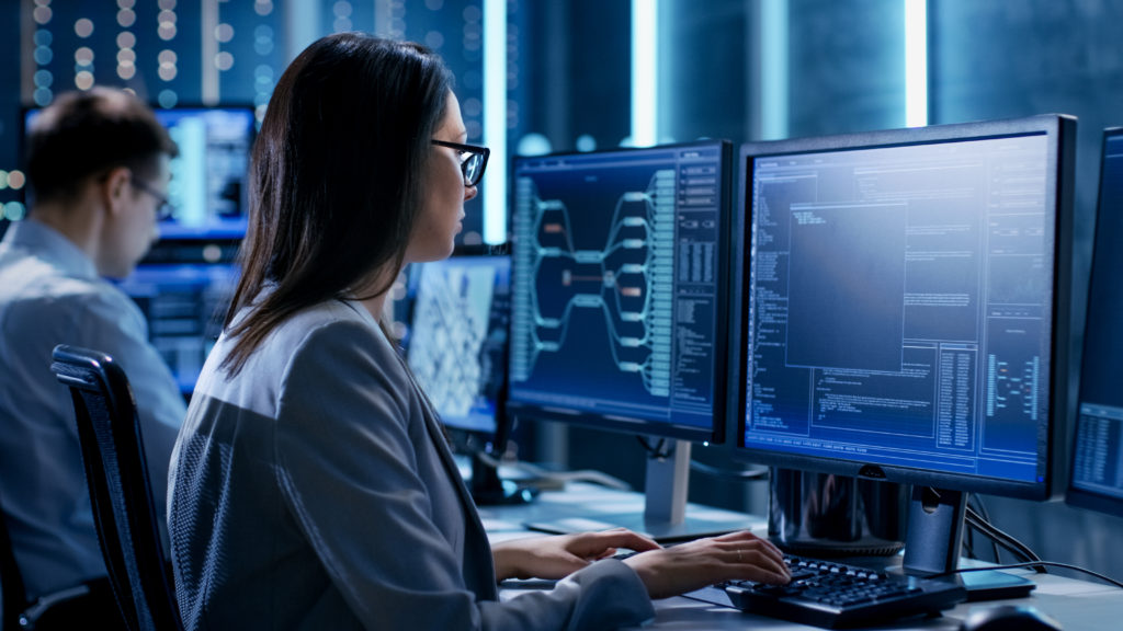 Over,The,Shoulder,Footage,Of,Female,It,Engineer,Working,In